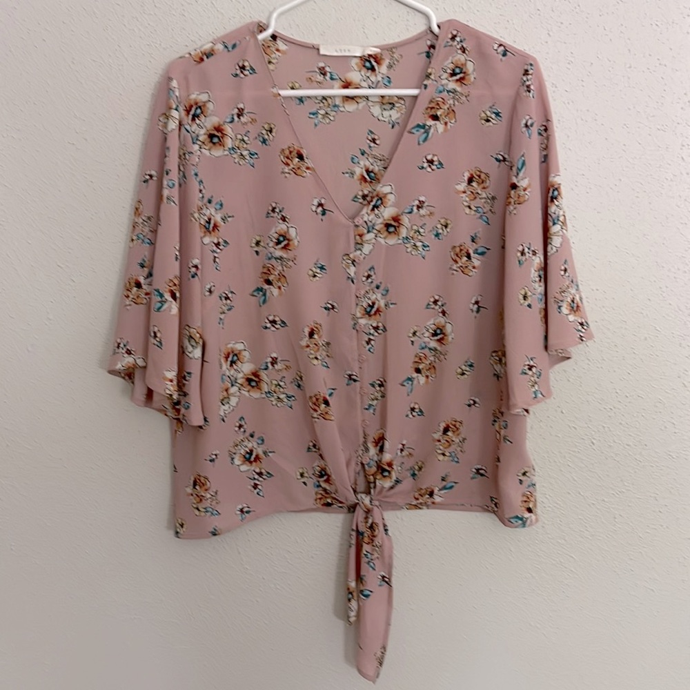 Pink floral blouse with tie front.